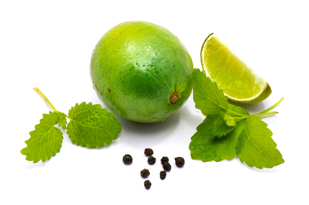 One whole one slice, lemon balm herb and pepper isolated on white background