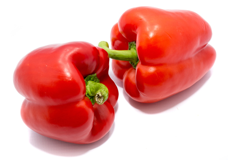 Group of red peppers, one pepper on back, isolated on white background
の写真素材