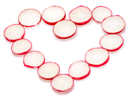 Sliced red radish in form of heart isolated on white background
の写真素材