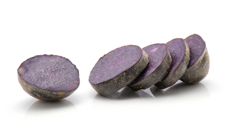 Sliced vitelotte potato isolated on white background five purple slices
の写真素材
