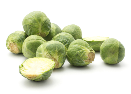 Raw Brussels sprout stack isolated on white background heads two sliced halves
の写真素材