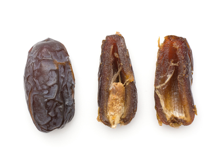 Date fruits Medjool variety top view isolated on white background one whole two halves one with a seed compare
の写真素材