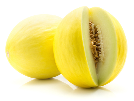 Two yellow honeydew melons isolated on white background one cut open with seeds
の写真素材