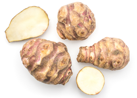 Three Jerusalem artichoke tubers with two halves isolated on white background sweet crisp topinambur top view
の写真素材