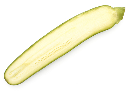 One green zucchini half top view isolated on white background long raw courgette cross sectionの写真素材