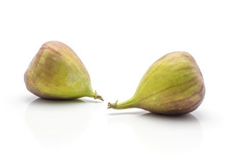 Two figs purple green isolated on white background ripe fresh
の写真素材