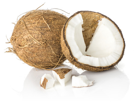 One coconut broken half with three pieces isolated on white background brown fibrous shell with milk meat
の写真素材