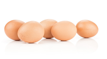 Brown chicken eggs stack isolated on white background set of five domestic