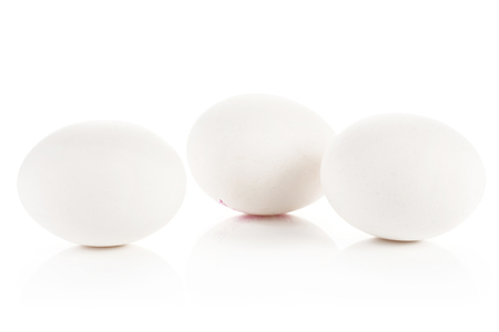 Three white chicken eggs group isolated on white background
の写真素材