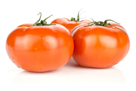 Three red tomato with vine ends isolated on white background fresh whole
の写真素材