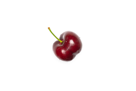 One whole sweet bright red cherry flatlay isolated on whiteの写真素材