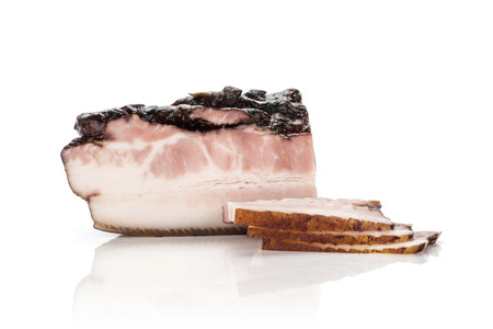Group of three slices one piece of english bacon isolated on whiteの写真素材