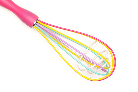 One whole kitchen tool colourful cage balloon whisk flatlay isolated on white