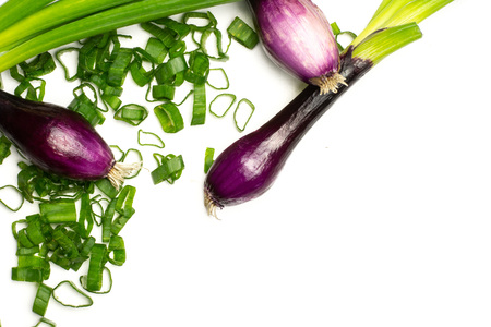 Group of three whole fresh green spring onion red scallion variety with chopped pieces flatlay isolated on whiteの写真素材