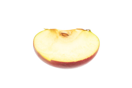 One slice of fresh red apple james grieve variety flatlay isolated on white backgroundの写真素材