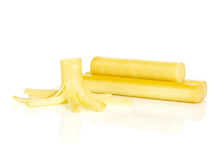 Group of three whole one piece of smoked slovak string cheese stick isolated on white background