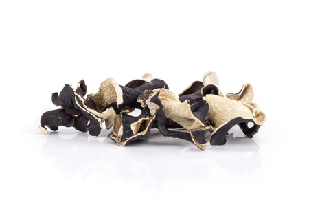 Lot of slices of dry black mushroom jew ear variety isolated on white backgroundの写真素材
