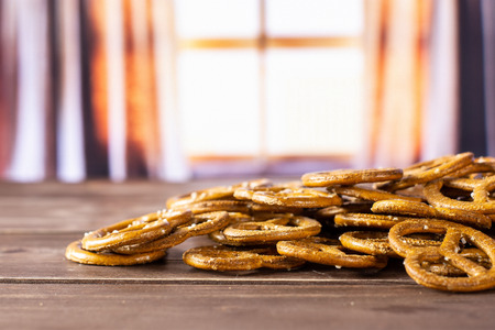 Lot of whole mini salted pretzels with silk curtains
