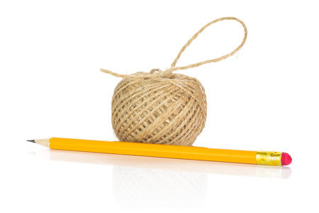 One whole sharpened yellow pencil with jute spool isolated on white backgroundの写真素材