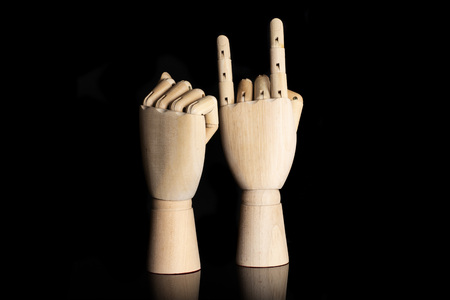 Two hands. sign of the horns. deaf sign language isolated on black glassの写真素材