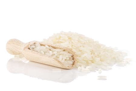 Lot of whole white jasmine rice grains isolated on white backgroundの写真素材