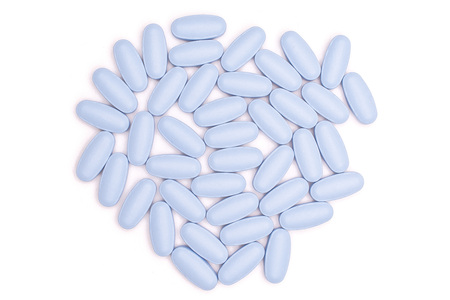 Lot of whole blue medical drug flatlay isolated on white background