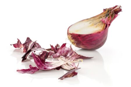 One half lot of pieces of stale red onion isolated on white backgroundの写真素材