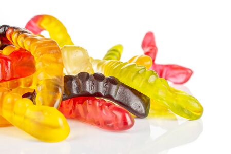 Lot of whole colourful jelly worm candy macro isolated on white backgroundの写真素材
