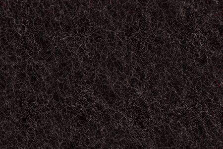 Black cleaning kitchen sponge macro isolatedの写真素材