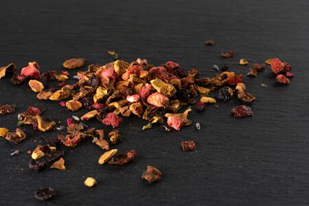 Lot of pieces of lavender strawberry ice tea on grey stoneの写真素材