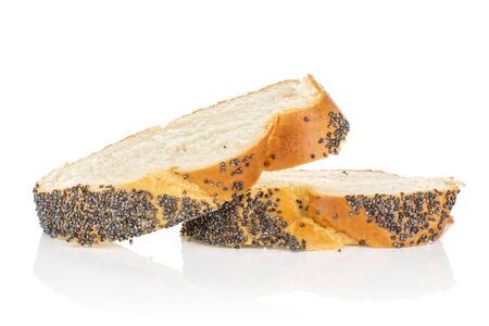 Group of two slices of twisted poppy seed bun isolated on white backgroundの写真素材
