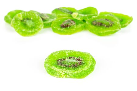Lot of slices of sweet green candied kiwifruit isolated on white backgroundの写真素材