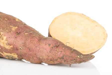Group of one whole one slice of fresh brown sweet potato isolated on white backgroundの写真素材
