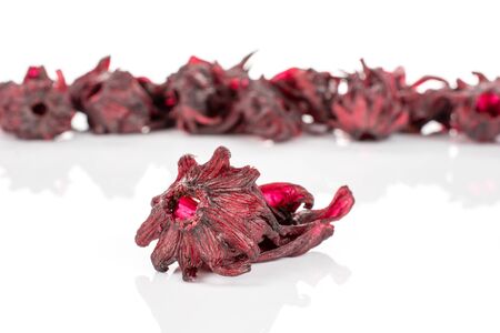 Lot of whole sweet red candied hibiscus one is aside isolated on white backgroundの写真素材