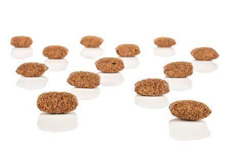 Lot of whole crispy brown cereal pillow isolated on white backgroundの写真素材