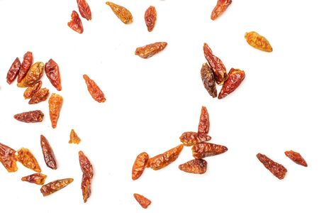 Lot of whole dry red chili pepper peperoncino flatlay isolated on white background