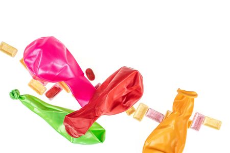 Lot of whole latex pastel ballon with pastel candies flatlay isolated on white backgroundの写真素材