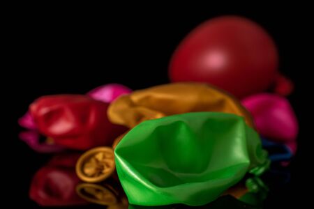 Lot of whole latex pastel ballon isolated on black glass