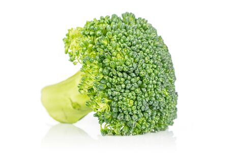 One whole fresh green broccoli front focus isolated on white backgroundの写真素材