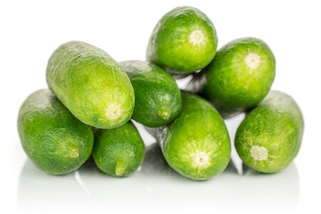 Group of seven whole mini green cucumber isolated on white backgroundの写真素材