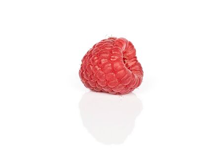 One whole fresh red raspberry isolated on white backgroundの写真素材