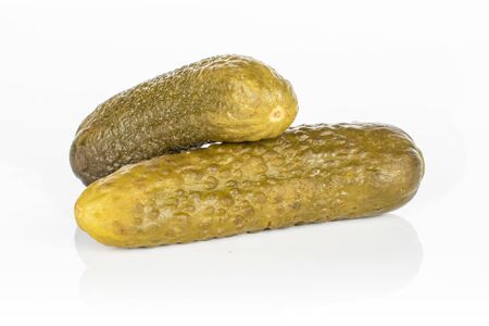 Group of two whole sour green pickle isolated on white backgroundの写真素材