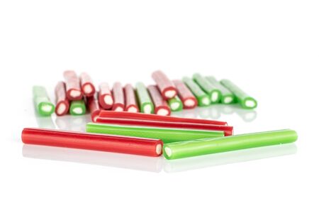 Lot of whole sweet stick candy front focus isolated on white backgroundの写真素材