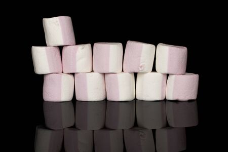 Lot of whole sweet pastel marshmallow wall isolated on black glassの写真素材
