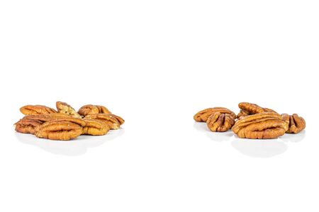 Lot of whole dry brown pecan nut isolated on white backgroundの写真素材