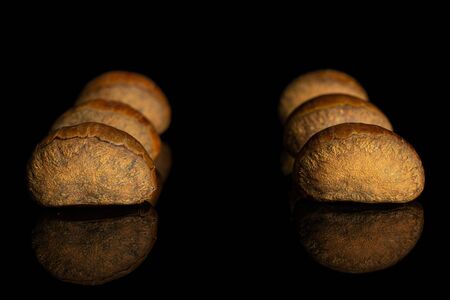 Group of six whole sweet brown chestnut isolated on black glassの写真素材