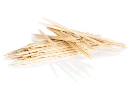 Lot of whole disordered wooden brown toothpick isolated on white background