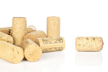 Lot of whole common wine cork stack isolated on white background