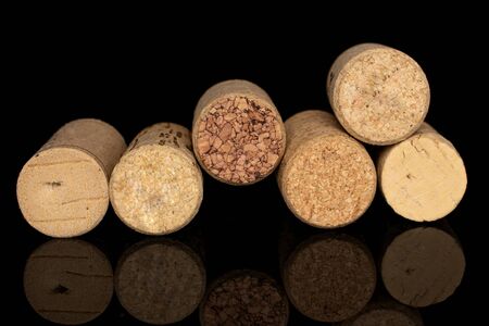 Group of six whole common wine cork isolated on black glassの写真素材