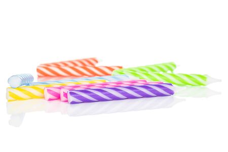 Lot of whole disordered birthday cake candle isolated on white backgroundの写真素材